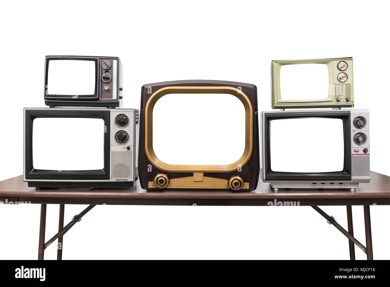 Five vintage televisions isolated on white with empty screens and clipping path. Stock Photo