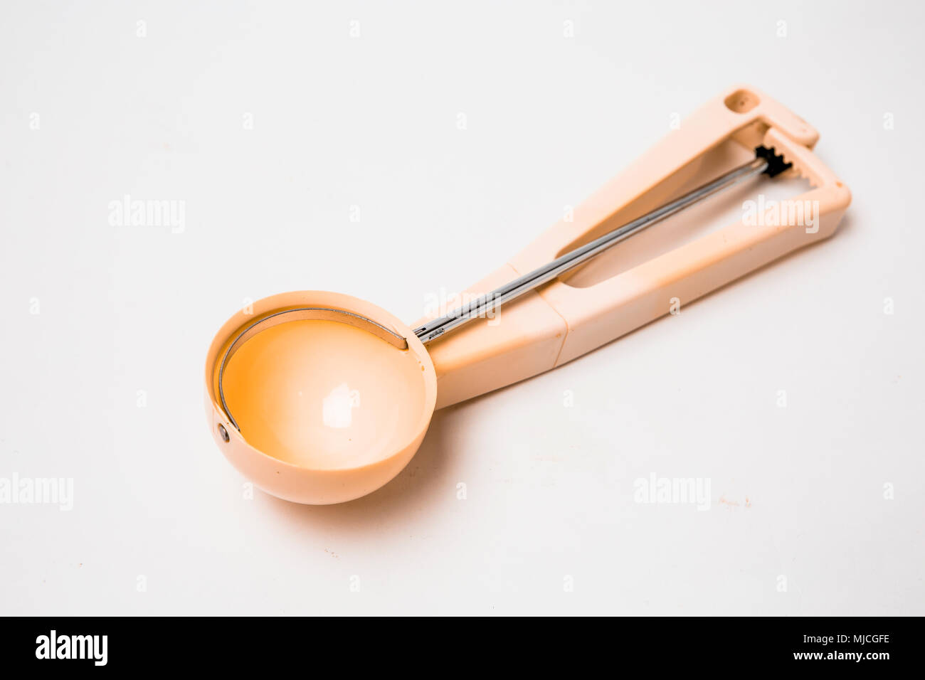 Spring release icecream scoop spoon isolated Stock Photo Alamy