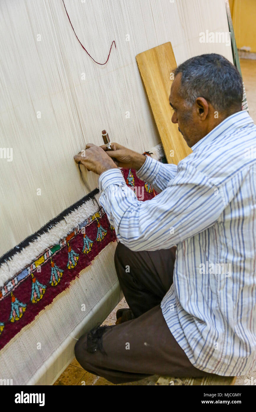 A carpet weaver at the El Tohamy Carpet School in Cairo, Egypt, Africa