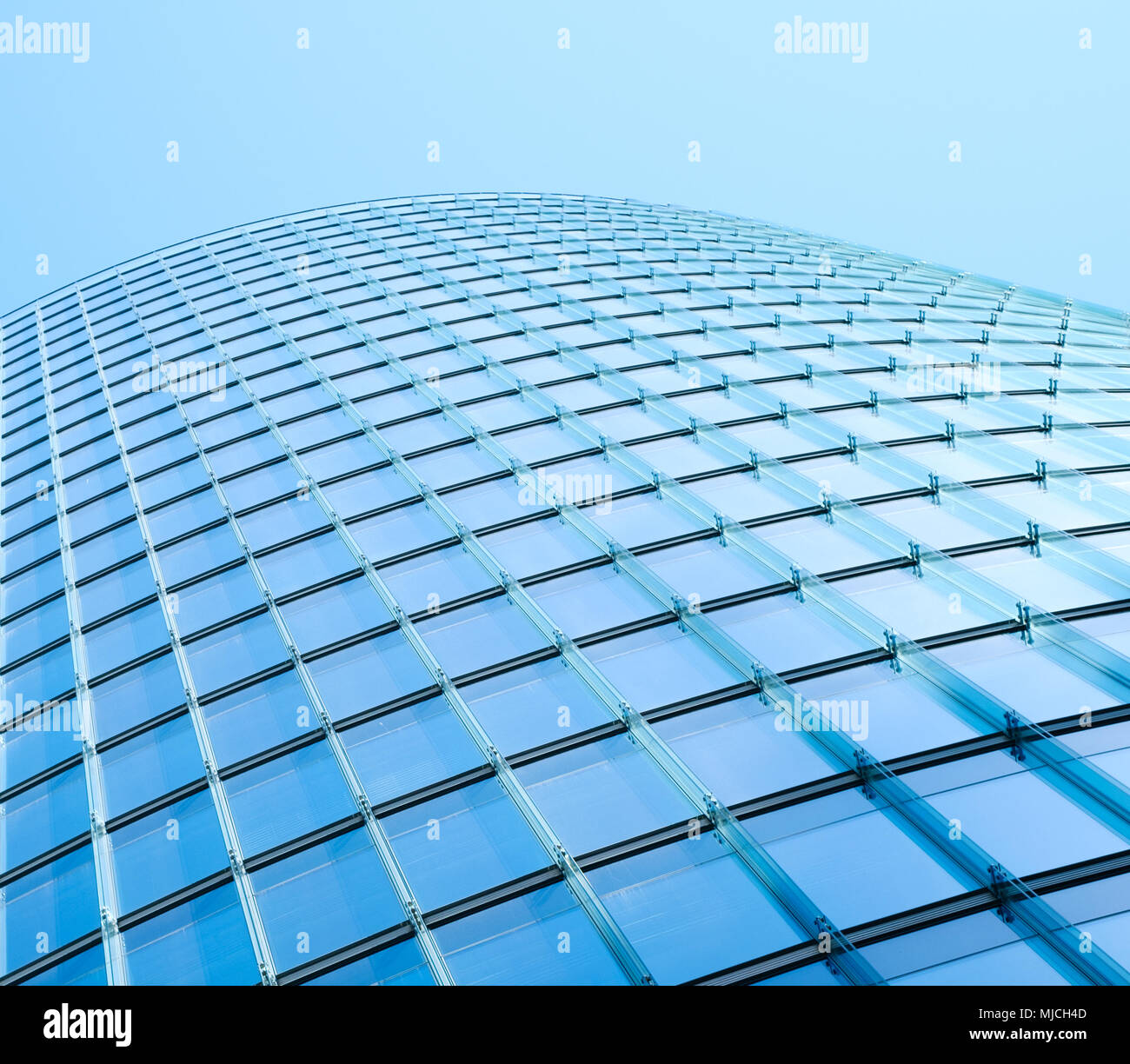 modern building facade - glass facade of skyscraper building - Stock Photo