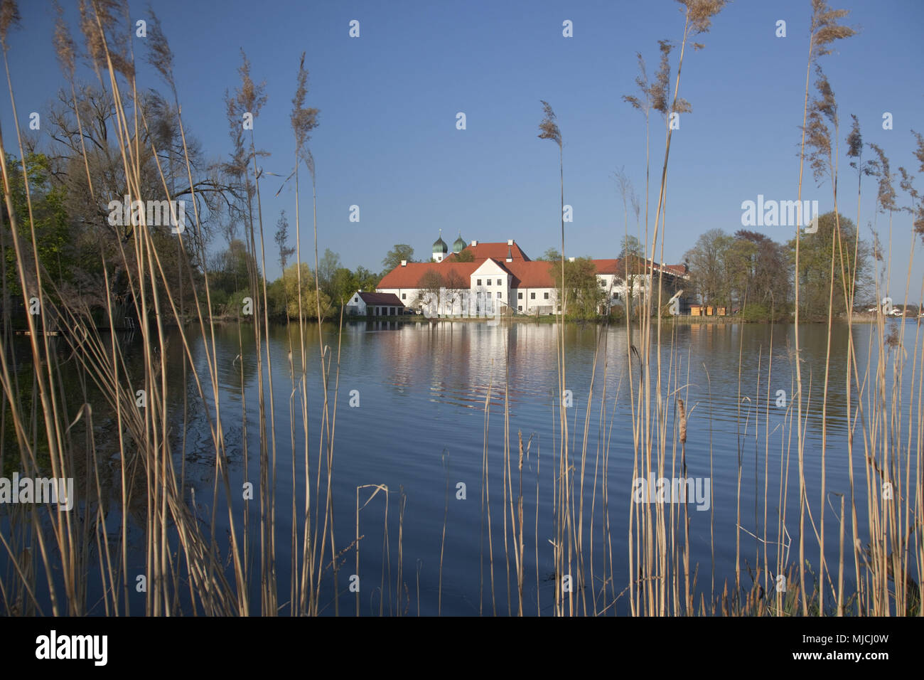 Abbey of Seeon in the lake Klostersee, Chiemgau, Seeon-Seebruck, Upper Bavaria, Bavaria, South Germany, Germany, Stock Photo