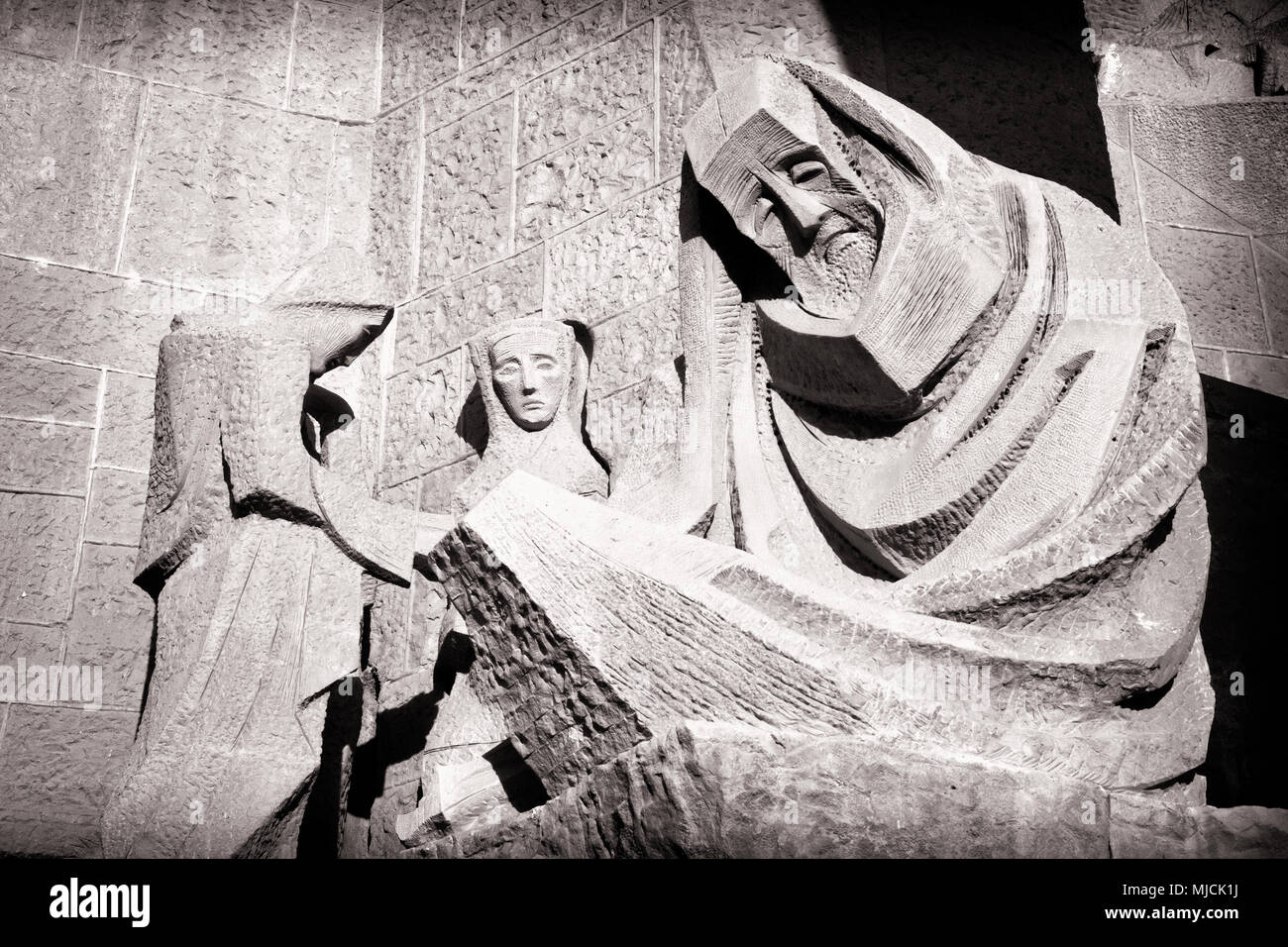 Black and white pictures of the art work of the Sagrada Familia, Barcelona. Here a close up on Peter and the three woman who questioned ( Subirachs ) Stock Photo