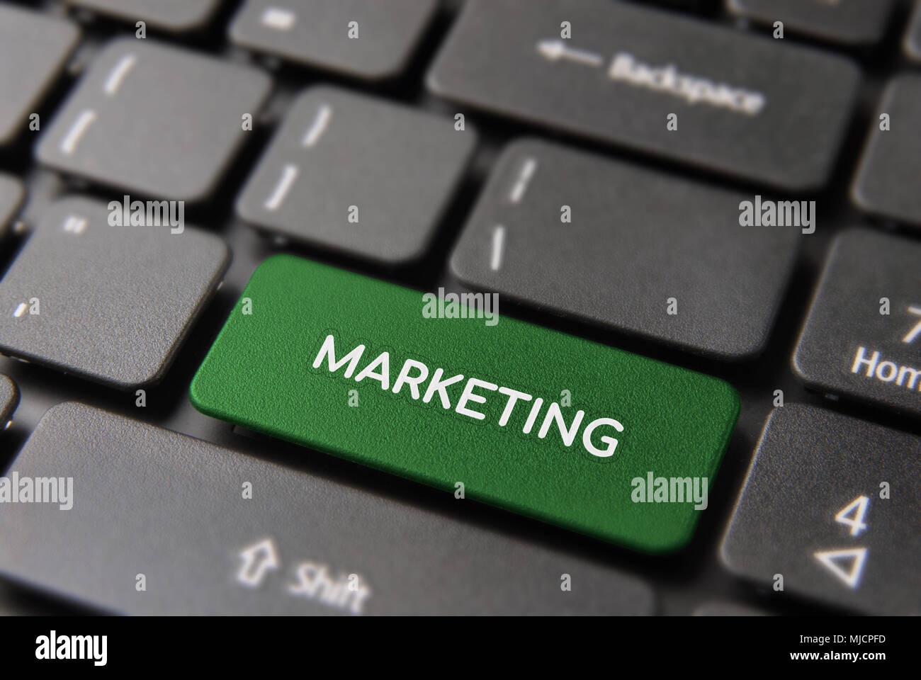 Digital marketing service concept, green computer button with text for online internet business. Stock Photo