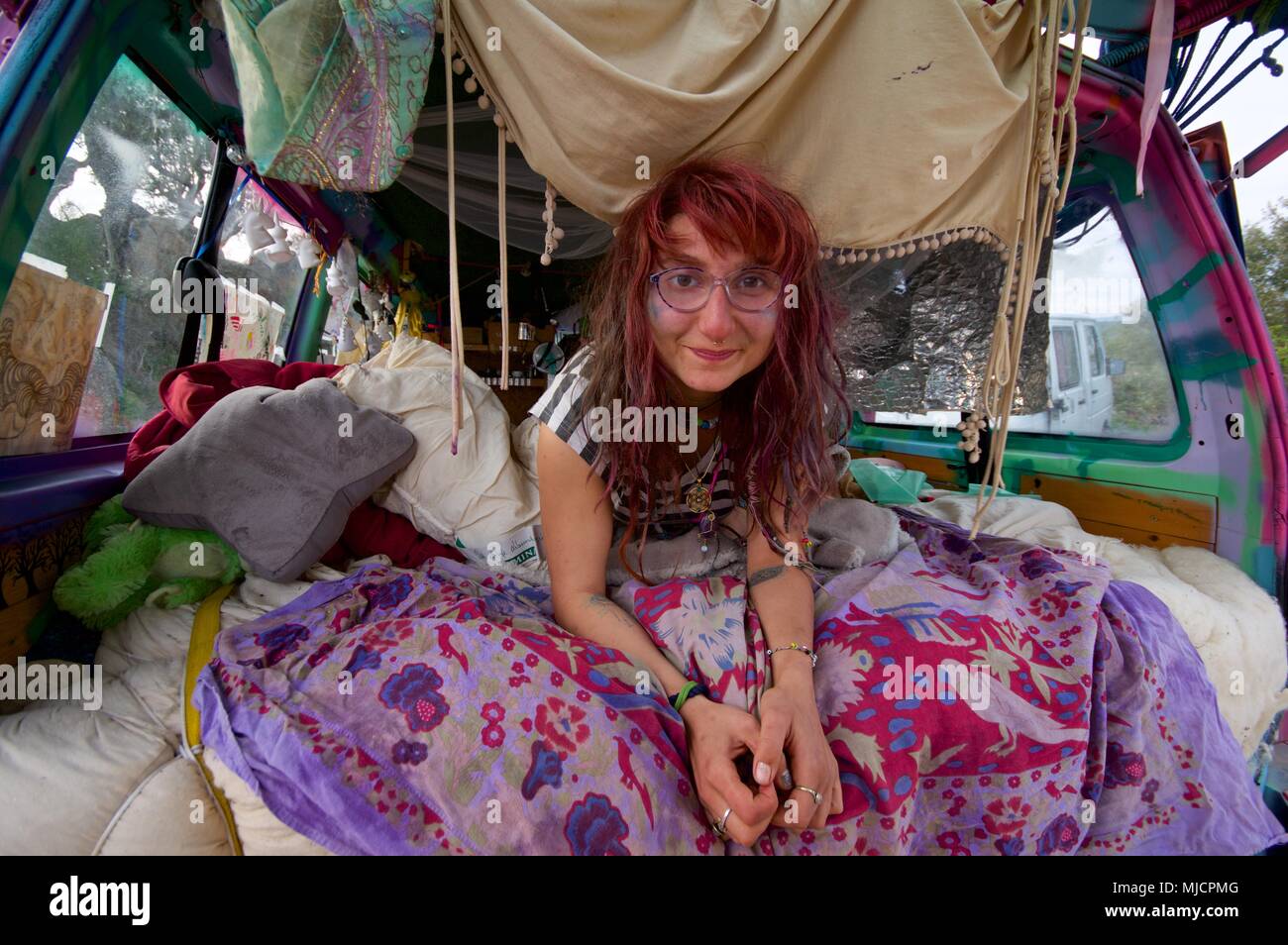 Hippie girl in her van Stock Photo