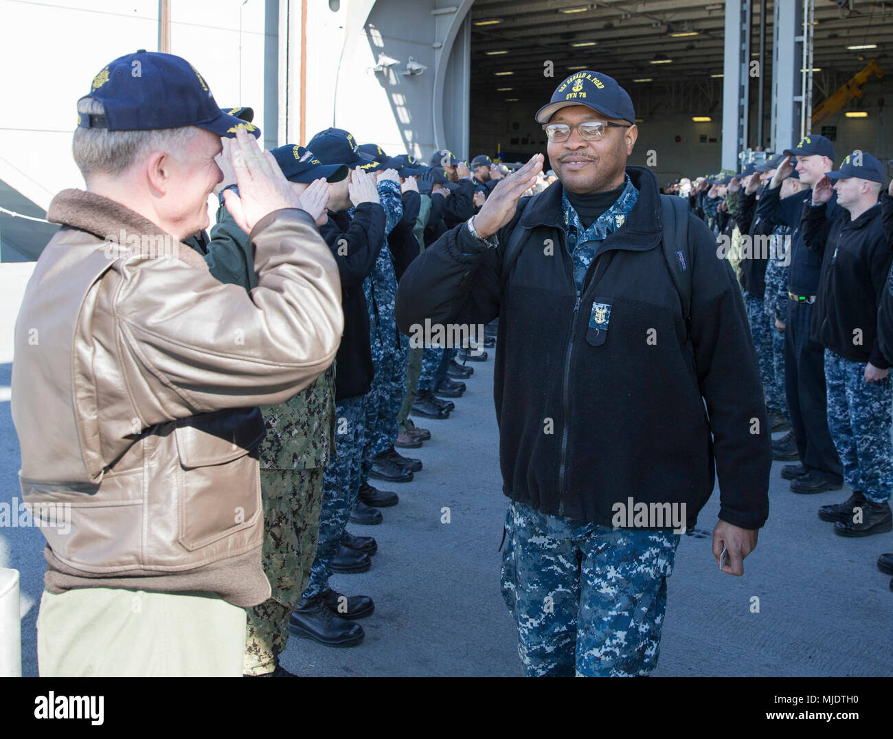 NORFOLK, Va. (Mar. 23, 2018) -- Master Chief Aviation Boatswain's Mate Kemmy Frazier returns the salute of Capt. Richard McCormack, USS Gerald R. Ford's (CVN 78) commanding officer, as he departs the command. (U.S. Navy Stock Photo
