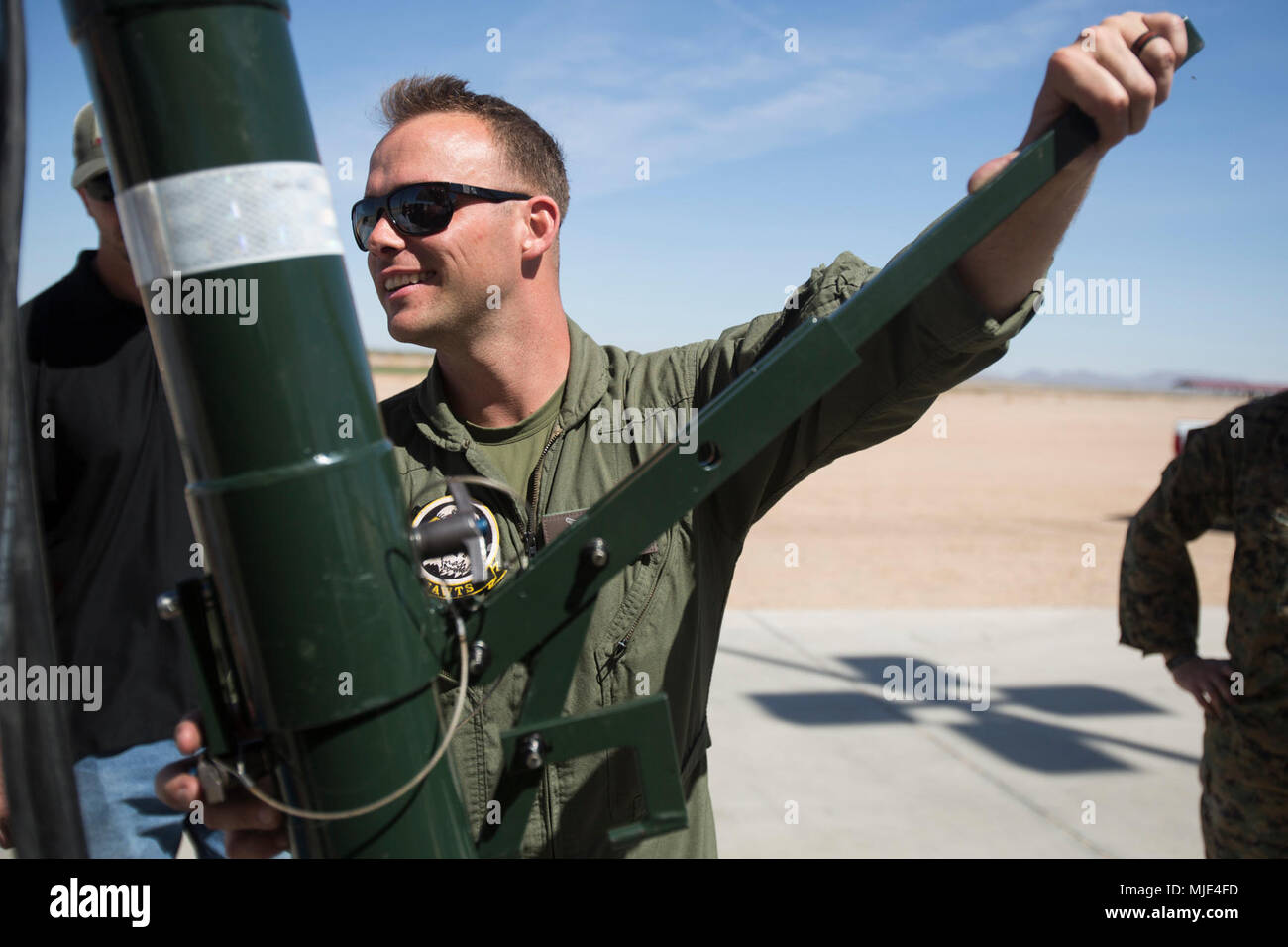 U.S. Marine Corps Gunnery Sgt. Jesse Wagner, Marine Aviation Logistics Squadron 14 aviation ordnance chief, assembles an A/E32K-11 munitions lifting assembly during training in support of Weapons and Tactics Instructor course 2-18 at Marine Corps Air Station Yuma, Ariz., March 14. WTI is a seven-week training event hosted by Marine Aviation Weapons and Tactics Squadron 1 cadre, which emphasizes operational integration of the six functions of Marine Corps aviation in support of a Marine Air Ground Task Force and provides standardized advanced tactical training and certification of unit instruct Stock Photo