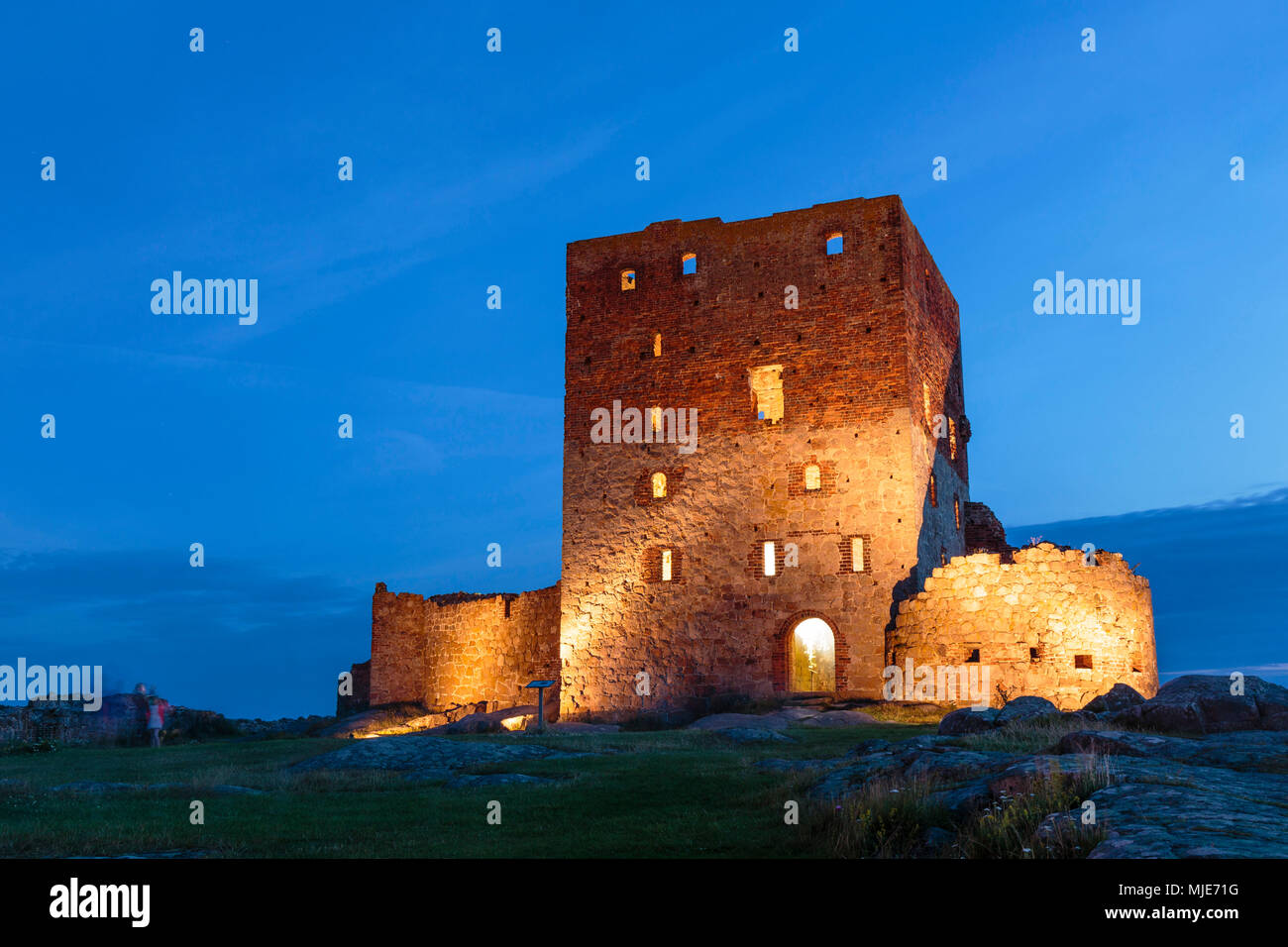 The illuminated, huge residential tower of the Hammershus castle ruin