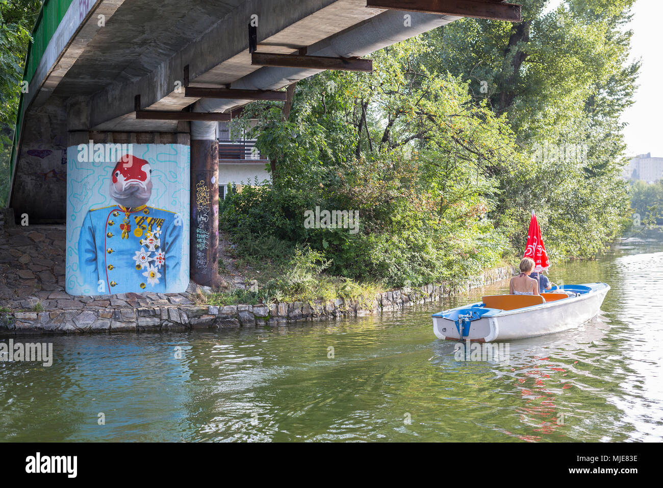 On the 'Alte Donau', graffiti on a pier, electric boat, Kaisermühlen, 22nd district, Donaustadt, Vienna, Austria Stock Photo