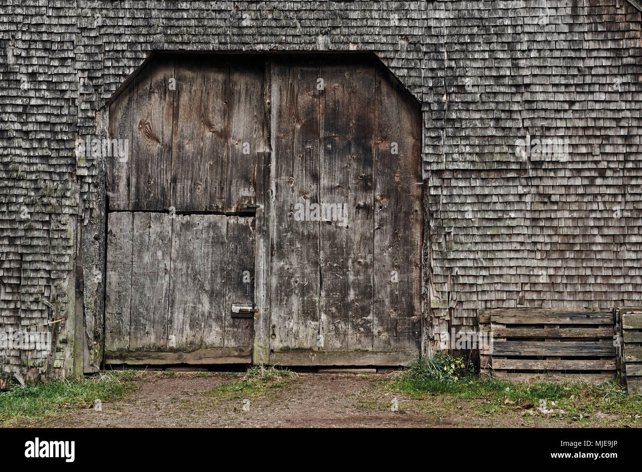 old shingles and gate, grey and weathered on a wooden house in the Black Forest, detail Stock Photo