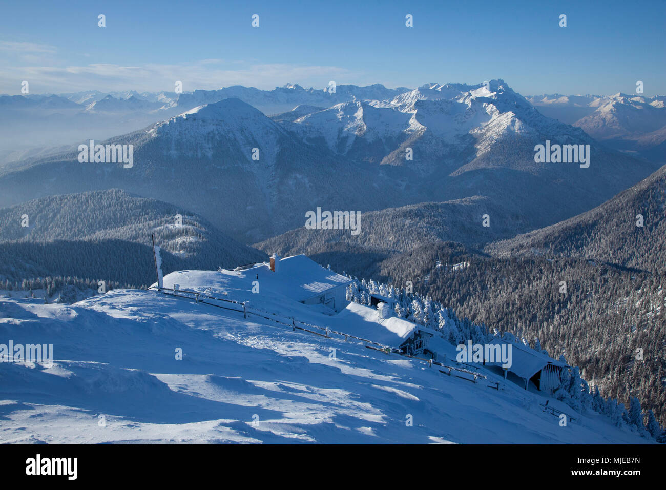view from summit of Heimgarten to Estergebirge (mountain range) and Zugspitze in winter, Bavarian Alps, Bavaria, Germany Stock Photo