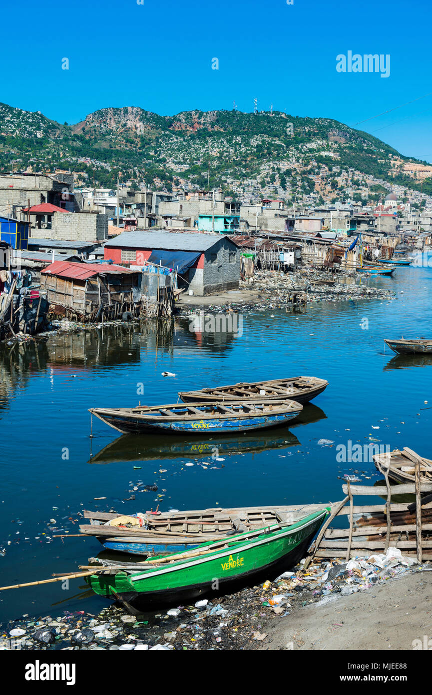 Totally polluted river Mapou flowing through Cap Haitien, Haiti, Caribbean Stock Photo