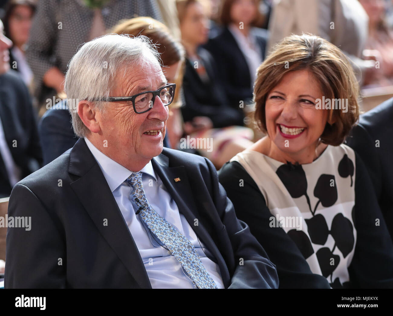 Trier, Germany. 4th May, 2018. European Commission President Jean-Claude Juncker (L) and governor of Rhineland-Palatinate Malu Dreyer talk prior to the opening ceremony of the Karl Marx exhibition, at the Basilica of Constantine in Trier, Germany, on May 4, 2018. European Commission President Jean-Claude Juncker said Friday that Karl Marx was a forward-looking philosopher and his works changed the world, as Marx's hometown Trier is marking the thinker's 200th birthday. Credit: Shan Yuqi/Xinhua/Alamy Live News Stock Photo