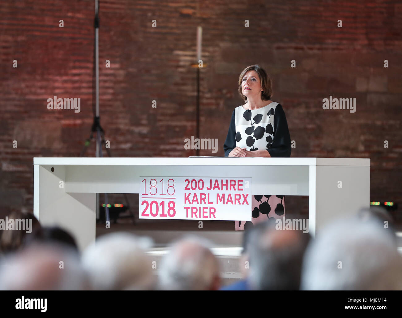 Trier, Germany. 4th May, 2018. Governor of Rhineland-Palatinate Malu Dreyer delivers a speech during the opening ceremony of the Karl Marx exhibition, at the Basilica of Constantine in Trier, Germany, on May 4, 2018. European Commission President Jean-Claude Juncker said Friday that Karl Marx was a forward-looking philosopher and his works changed the world, as Marx's hometown Trier is marking the thinker's 200th birthday. Credit: Shan Yuqi/Xinhua/Alamy Live News Stock Photo