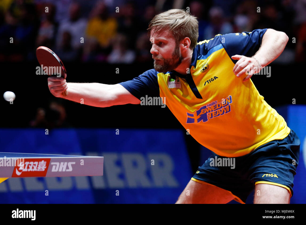 Halmstad, Sweden. 4th May, 2018. Jon Persson of Sweden returns the ball to  Samuel Walker of England during the Men's group quarterfinal match at the  2018 World Team Table Tennis Championships in