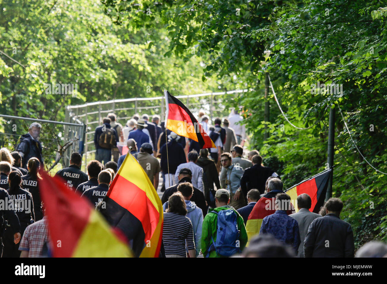 Neustadt, Germany. 5th May 2018. Participants of the 'Patriotic Hike' walk up the hill to the Haibach Castle, carrying German flags. The New Hambach Festival, organised by national-conservative and members of the new right, took place at the Hambach Castle. Organised by controversial Christian Democratic Union of Germany) member and Alternative for Germany) sympathiser Max Otte, it sees controversial speakers such as Thilo Sarrazin, Vera Lengsfeld and Federal spokesman for the AfD Jorg Meuthen. Credit: Michael Debets/Alamy Live News Stock Photo