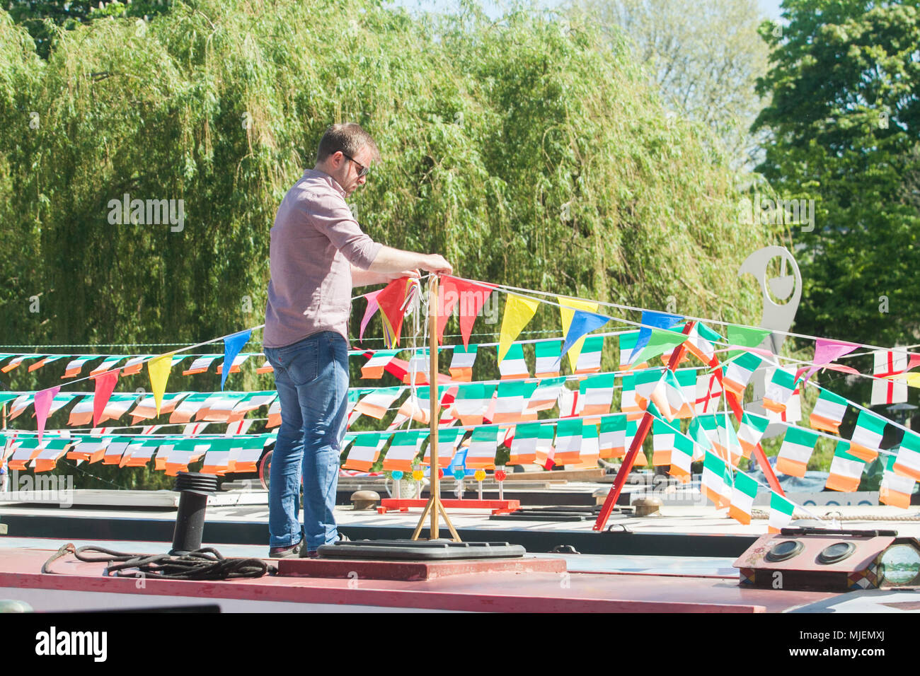 London, UK. 5th May, 2018. Colourful bunting decorate barges at The  International Water Association (IWA) Canalway Cavalcade held over the May Bank Holiday weekend is London's biggest, brightest  and best waterways festival  with an array of boats, trade show stalls and boat gatherings  which has been taking place at Little Venice  in North London since 1983. Credit: amer ghazzal/Alamy Live News Stock Photo