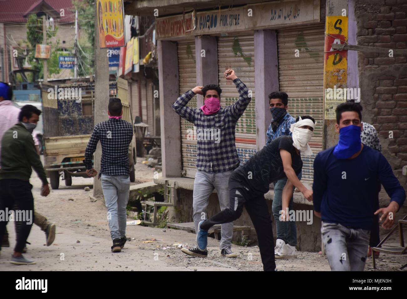 May 5, 2018 - Srinagar, Jammu & Kashmir, India - People clashes with forces near the Encounter site in Srinagar.4 Killed and several injured in an encounter between Indian forces and militants at chatabal area of Srinagar summer capital of Indian Kashmir on Saturday. Three militants were killed during a brief shootout after government forces laid seige around densely populated chatabal area of Srinagar. A young man also died after he was hit by the armoured vehicle during the clashes between the residents and police force as residents tried to help the Militants in escape. (Credit Image: © Ab Stock Photo