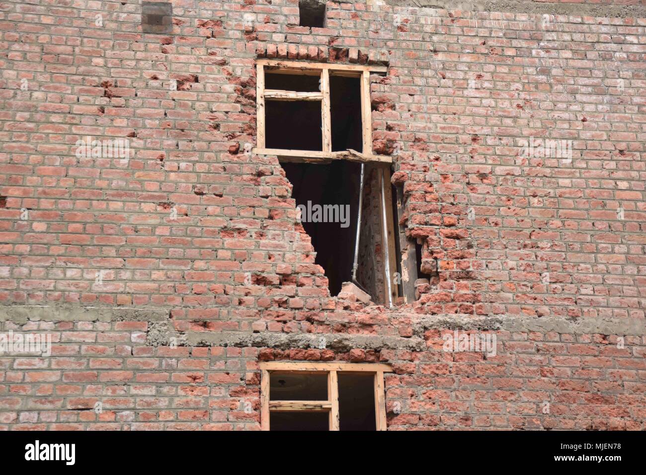 May 5, 2018 - Srinagar, Jammu & Kashmir, India - Damaged parts of Residencial building which were gutted during Encounter in Srinagar.4 Killed and several injured in an encounter between Indian forces and militants at chatabal area of Srinagar summer capital of Indian Kashmir on Saturday. Three militants were killed during a brief shootout after government forces laid seige around densely populated chatabal area of Srinagar. A young man also died after he was hit by the armoured vehicle during the clashes between the residents and police force as residents tried to help the Militants in escap Stock Photo