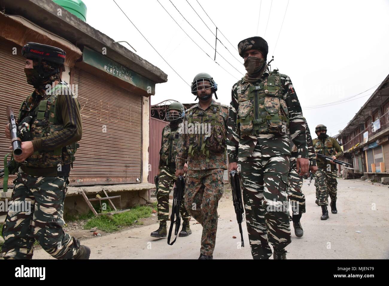 May 5, 2018 - Srinagar, Jammu & Kashmir, India - Indian army patrolling and standing guard near the Encounter site in Srinagar. 4 Killed and several injured in an encounter between Indian forces and militants at chatabal area of Srinagar summer capital of Indian Kashmir on Saturday. Three militants were killed during a brief shootout after government forces laid seige around densely populated chatabal area of Srinagar. A young man also died after he was hit by the armoured vehicle during the clashes between the residents and police force as residents tried to help the Militants in escape. (Cr Stock Photo