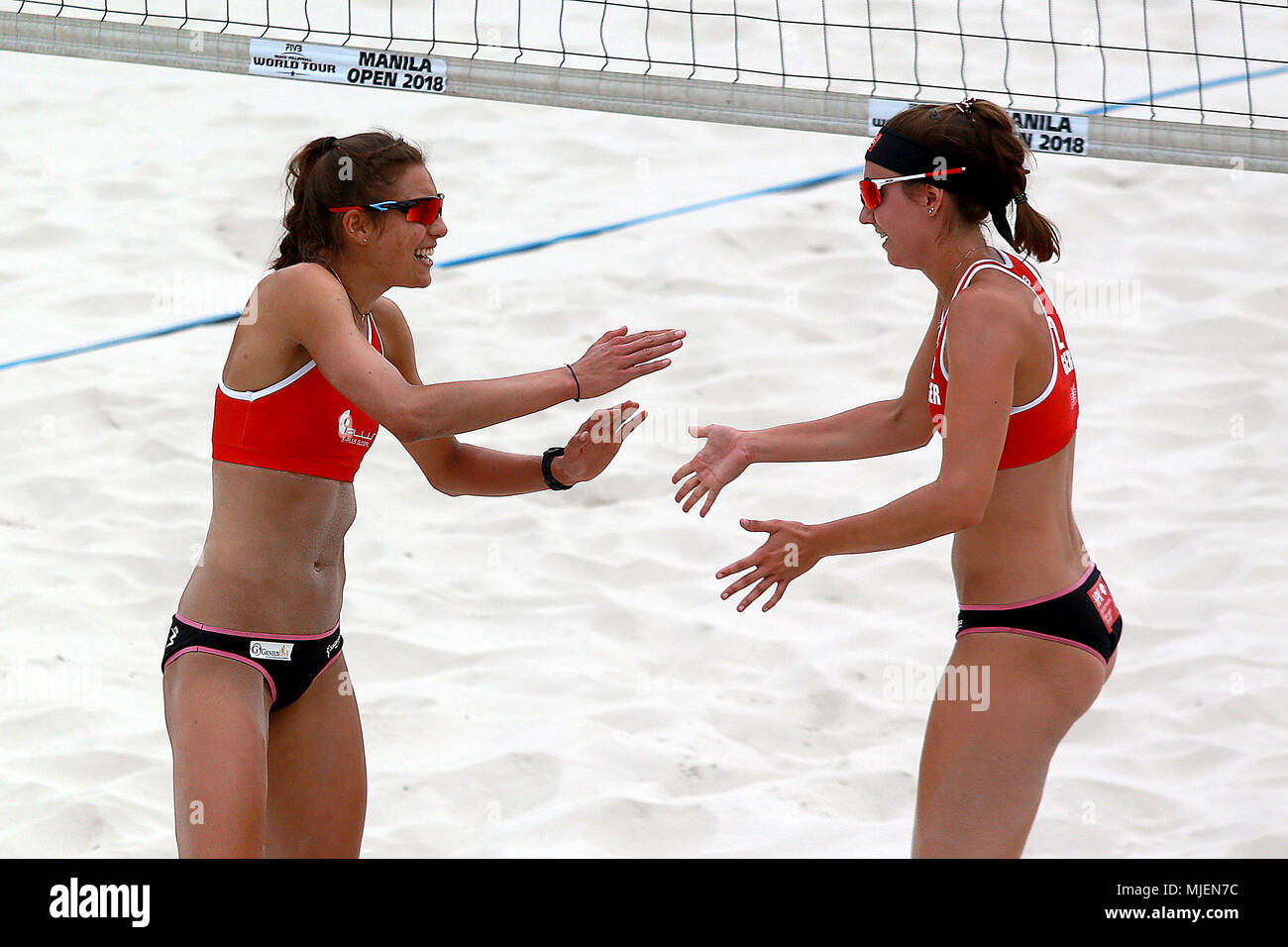 Manila, Philippines. 5th May, 2018. Germany's Leonie Klinke (L) /Lisa-Sophie Kotzan celebrate after scoring during the women's round of 12 match between Germany's Leonie Klinke/Lisa-Sophie Kotzan and Katja Stam/Julia Wouters of the Netherlands at the FIVB Beach Volleyball World Tour in Manila, the Philippines, on May 5, 2018. Germany's Leonie Klinke/Lisa-Sophie Kotzan won by 2-0. Credit: Rouelle Umali/Xinhua/Alamy Live News Stock Photo