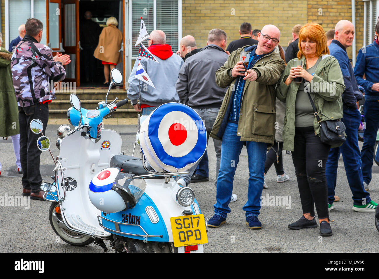Troon, Ayrshire, UK. 5th May, 2018. Over 100 scooters, riders and passengers attended the annual Scottish Mod Rally in Troon, one of the largest Mod meetings in Scotland with scooters coming from all across the country. Before the final customary 'Ride out' through the town, there were competitions and prizes for the best vintage, best presented and furthest travelled scooters when the owners take pride in presenting their scooters and themselves in best order. Credit: Findlay/Alamy Live News Stock Photo