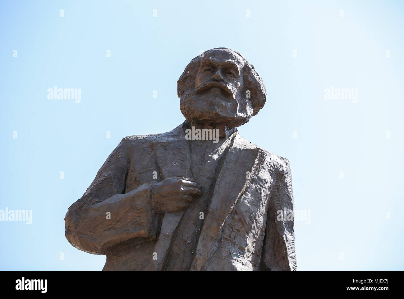 Trier. 5th May, 2018. Photo taken on May 5, 2018 shows a view of the Karl Marx statue in Trier, Germany. A China-donated statue of German philosopher Karl Marx was unveiled on Saturday in his birth town on the 200th anniversary of his birth. Credit: Shan Yuqi/Xinhua/Alamy Live News Stock Photo