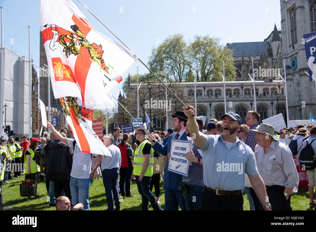London, UK, 5th May 2018, Members of the March for Life UK held a march through central London. Several males wave flags in Parliment Suare at the end of the march Credit: adrian looby/Alamy Live News Stock Photo