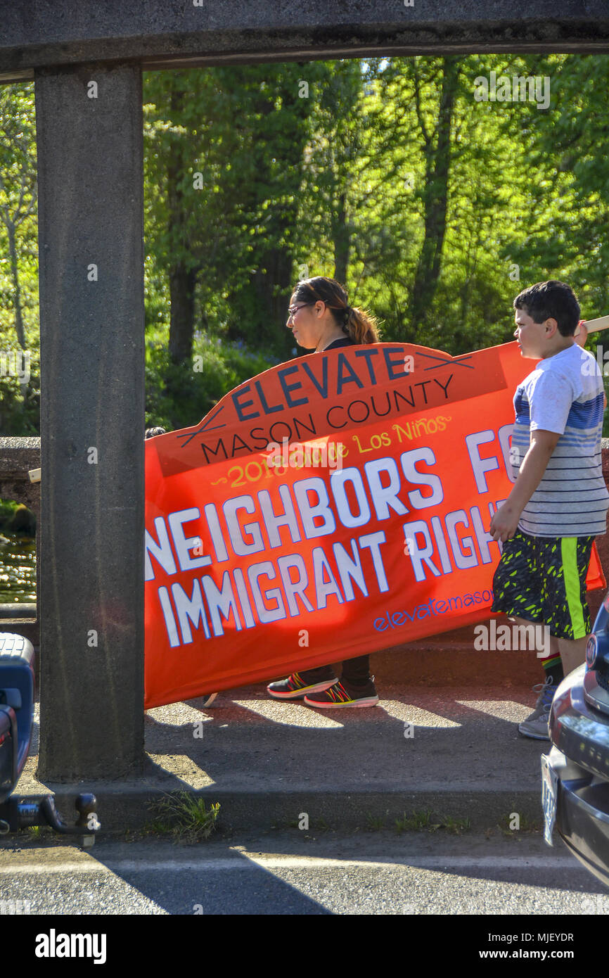 Shelton, Washington, USA. 5th May, 2018. 05/04/2018, 4:30pm ,  Shelton Washington, Elevate Mason County holds their annual immigrants rights march.  The March was escorted by the Shelton Police Department and followed a pre-planned route from Loop Field to Kneeland park  and stayed on the sidewalks.   About 200 people attended the march and rally.  The rally was held at Kneeland Park and including speakers,  live music, a children’s march and a taco truck. (Shawna Whelan) Credit: Shawna Whelan/Alamy Live News Stock Photo