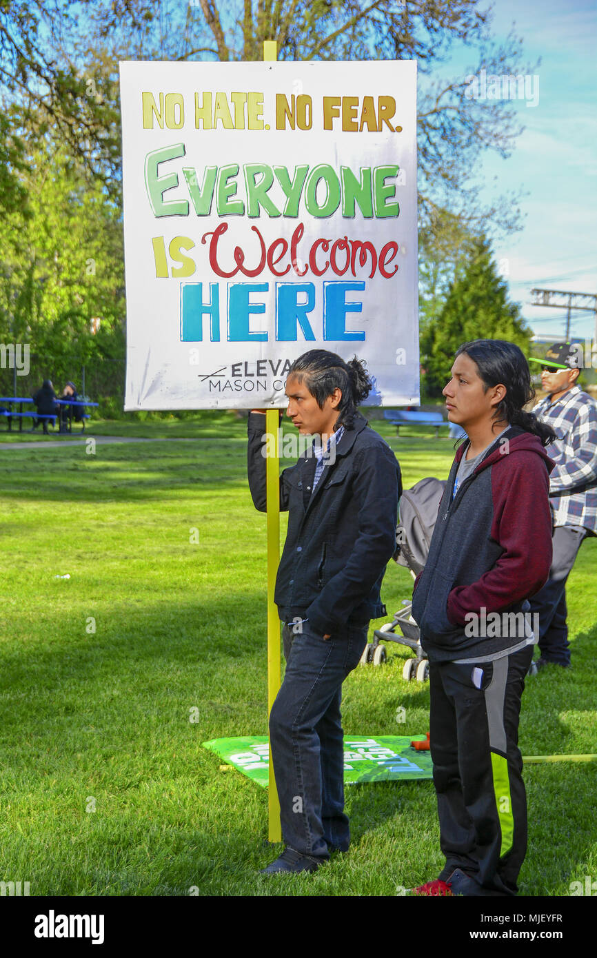 Shelton, Washington, USA. 5th May, 2018. 05/04/2018, 4:30pm ,  Shelton Washington, Elevate Mason County holds their annual immigrants rights march.  The March was escorted by the Shelton Police Department and followed a pre-planned route from Loop Field to Kneeland park  and stayed on the sidewalks.   About 200 people attended the march and rally.  The rally was held at Kneeland Park and including speakers,  live music, a children's march and a taco truck. (Shawna Whelan) Credit: Shawna Whelan/Alamy Live News Stock Photo