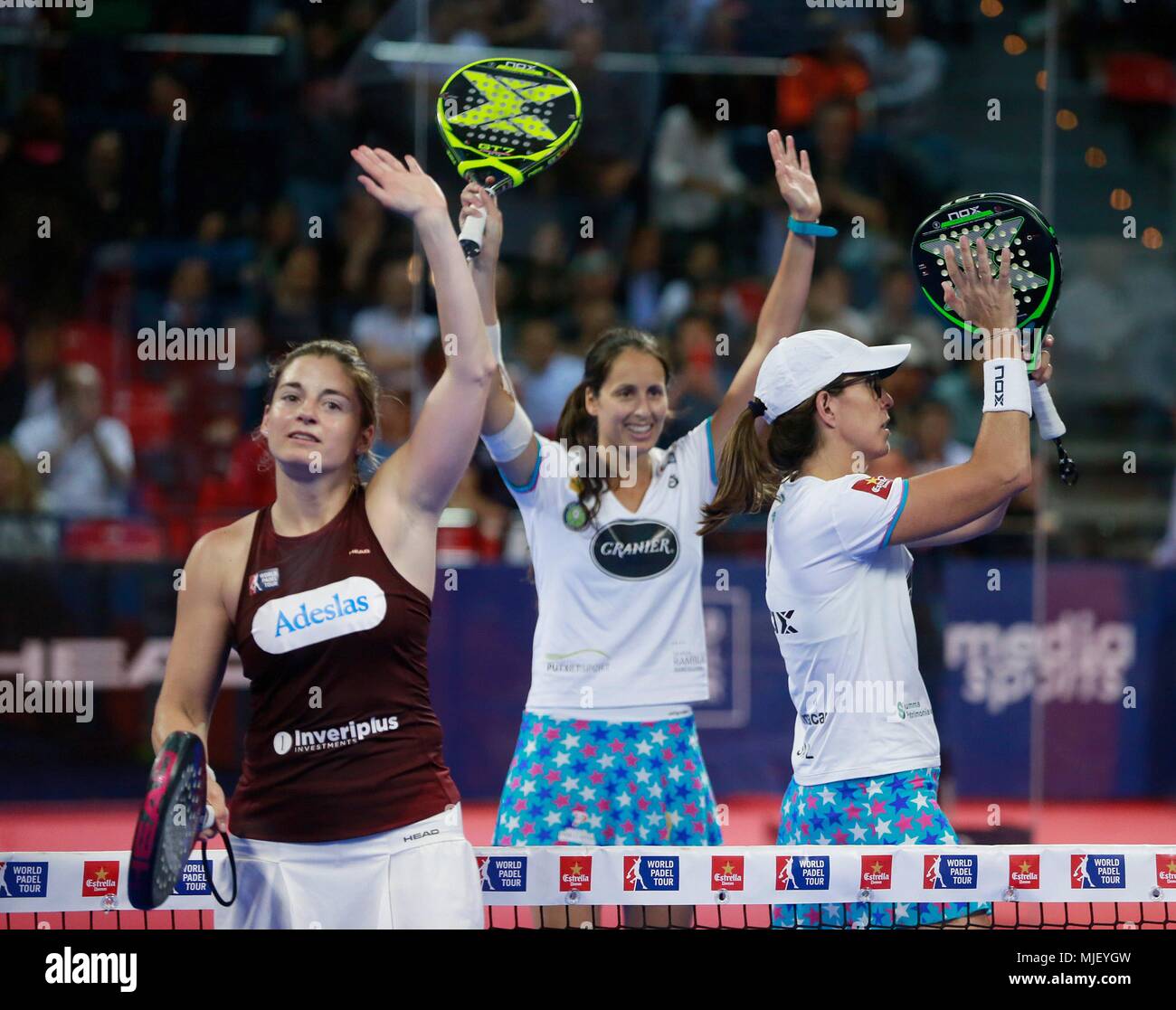Padel player Gemma Triay (C) and her mate Lucia Sainz (R) celebrate after  defeating Alejandra Salazar (L) and Marta Marrero (out of frame), during  the semifinals of the Estrella Damm Zaragoza Open