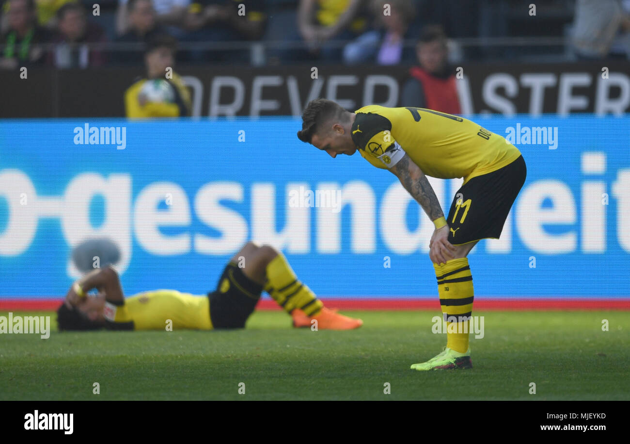 05 May 2018, Germany, Dortmund: Soccer, Bundesliga, Borussia Dortmund vs FSV Mainz 05 at the Signal Iduna Park. Dortmund's Marcel Schmelzer and Marco Reus. Photo: Ina Fassbender/dpa - IMPORTANT NOTICE: Due to the German Football League·s (DFL) accreditation regulations, publication and redistribution online and in online media is limited during the match to fifteen images per match Stock Photo