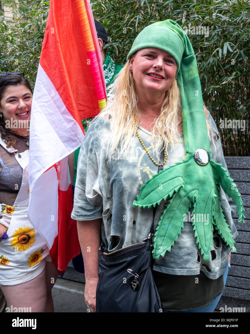 New York, USA, 5 May  2018. A protester with a marijuana-shaped hat participates in the NYC Cannabis parade, a four-decade old tradition in New York city to demand an end to cannabis prohibition. Photo by Enrique Shore / Alamy Live News Stock Photo