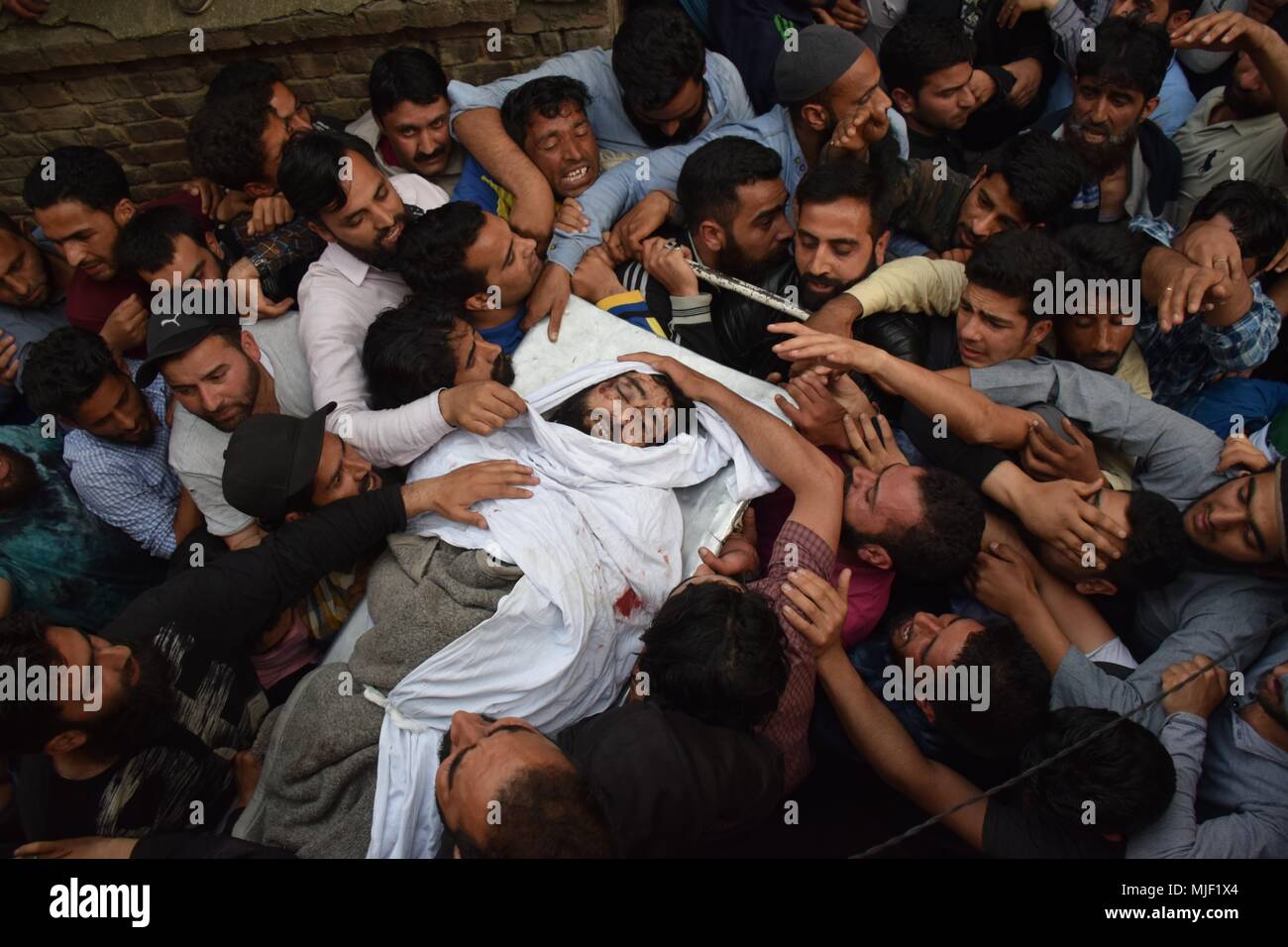 Srinagar, Jammu & Kashmir, India, May 5, 2018.  (EDITORS NOTE: Image depicts death.).People carrying body of militant Fayaz Ahmed Hamal at his residence Khankah Area of Srinagar Summer Capital Of Indian Kashmir on Saturday for burial.Multiple Funeral processions held in srinagar summer capital of Indian Kashmir on Saturday of Fayaz Ahmed Hamal a LeT (Lashkar-e-Taiba) Militant and a Civilian Adil Ahmed Yatoo who were killed by armoured vehicle on Saturday during clashes near Encounter site. Credit: ZUMA Press, Inc./Alamy Live News Stock Photo