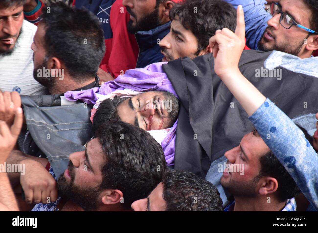 Srinagar, Jammu & Kashmir, India, May 5, 2018.  (EDITORS NOTE: Image depicts death.).People carrying the body of civilian Adil Ahmed Yatoo who got killed by armoured vehicle during clashes near Encounter site for burial During his funeral procession in Srinagar summer capital of Kashmir.Multiple Funeral processions held in srinagar summer capital of Indian Kashmir on Saturday of Fayaz Ahmed Hamal a LeT (Lashkar-e-Taiba) Militant and a Civilian Adil Ahmed Yatoo who were killed by armoured vehicle on Saturday during clashes near Encounter site. child Credit: ZUMA Press, Inc./Alamy Live News Stock Photo