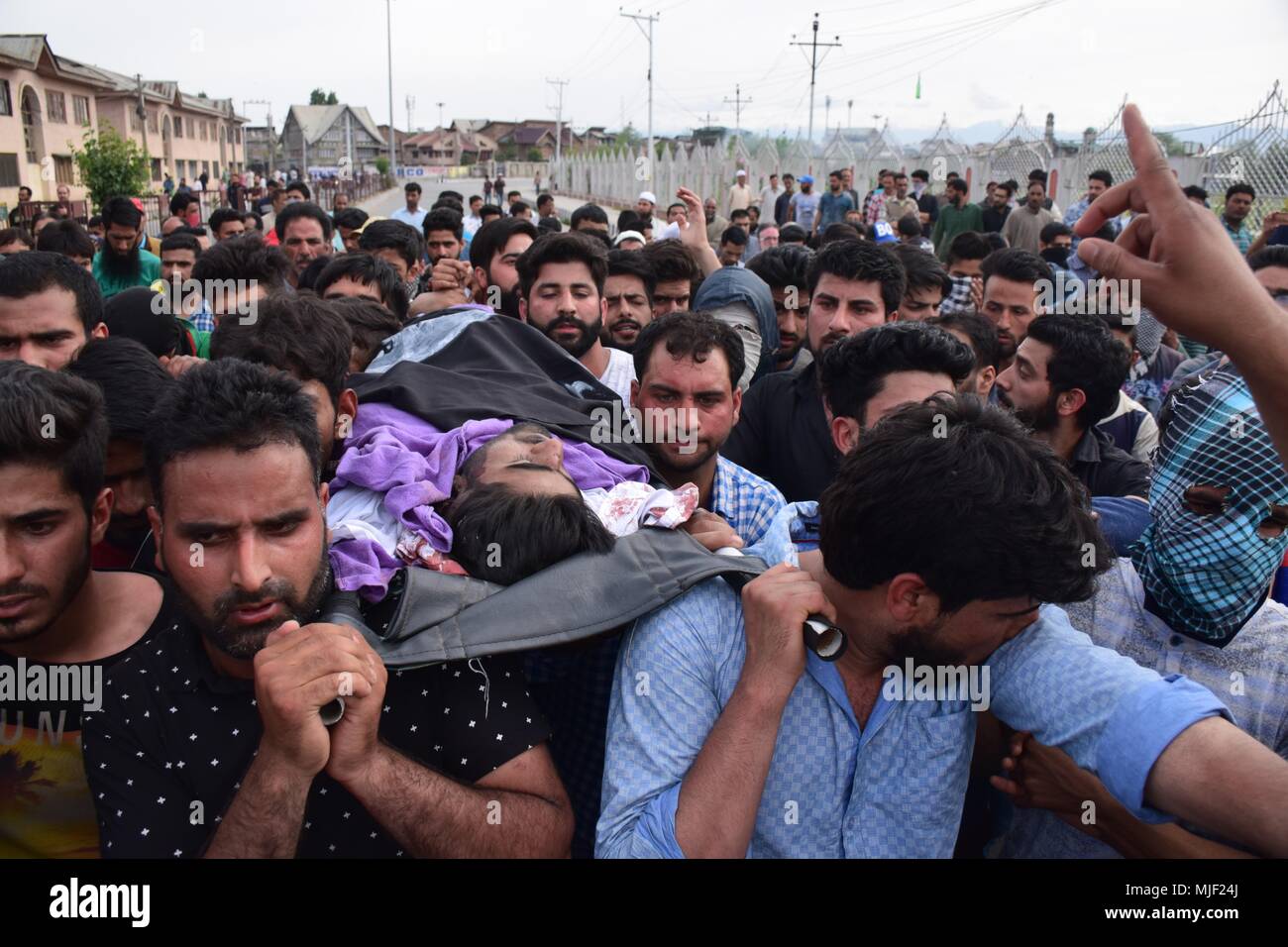 Srinagar, Jammu & Kashmir, India, May 5, 2018.  (EDITORS NOTE: Image depicts death.) .People carrying the body of civilian Adil Ahmed Yatoo who got killed by armoured vehicle during clashes near Encounter site for burial During his funeral procession in Srinagar summer capital of Kashmir.Multiple Funeral processions held in srinagar summer capital of Indian Kashmir on Saturday of Fayaz Ahmed Hamal a LeT (Lashkar-e-Taiba) Militant and a Civilian Adil Ahmed Yatoo who were killed by armoured vehicle on Saturday during clashes near Encounter site. chil Credit: ZUMA Press, Inc./Alamy Live News Stock Photo