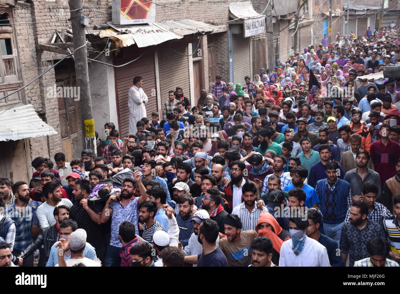 Srinagar, Jammu & Kashmir, India, May 5, 2018.  (EDITORS NOTE: Image depicts death.).People carrying the body of civilian Adil Ahmed Yatoo who got killed by armoured vehicle during clashes near Encounter site for burial During his funeral procession in Srinagar summer capital of Kashmir.Multiple Funeral processions held in srinagar summer capital of Indian Kashmir on Saturday of Fayaz Ahmed Hamal a LeT (Lashkar-e-Taiba) Militant and a Civilian Adil Ahmed Yatoo who were killed by armoured vehicle on Saturday during clashes near Encounter site. childr Credit: ZUMA Press, Inc./Alamy Live News Stock Photo