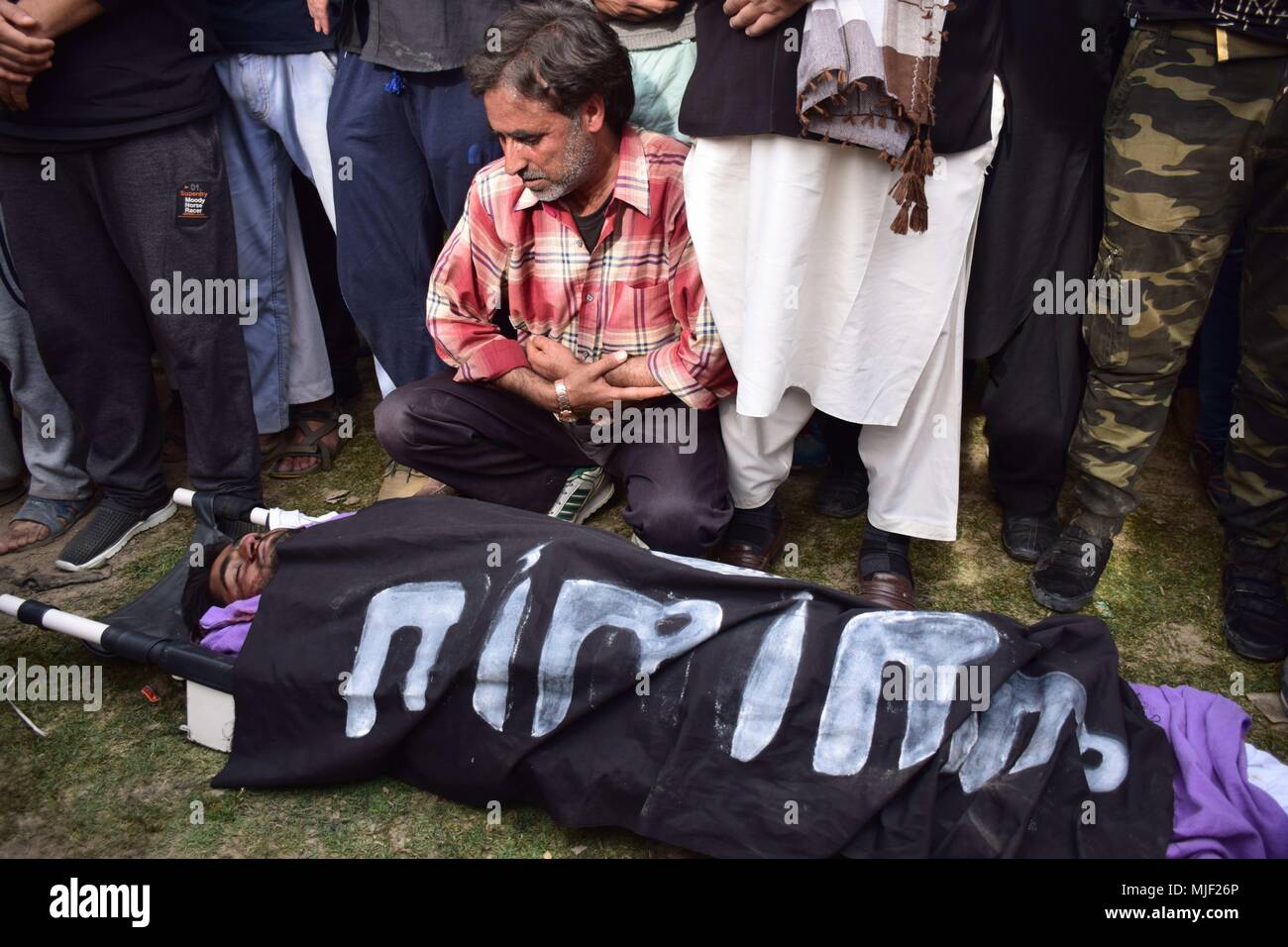 Srinagar, Jammu & Kashmir, India, May 5, 2018.  (EDITORS NOTE: Image depicts death.).People offering funeral prayers to Adil Ahmed Yatoo who got killed by armoured vehicle during clashes near Encounter site for burial During his funeral procession in Srinagar summer capital of Kashmir.Multiple Funeral processions held in srinagar summer capital of Indian Kashmir on Saturday of Fayaz Ahmed Hamal a LeT (Lashkar-e-Taiba) Militant and a Civilian Adil Ahmed Yatoo who were killed by armoured vehicle on Saturday during clashes near Encounter site. childre Credit: ZUMA Press, Inc./Alamy Live News Stock Photo