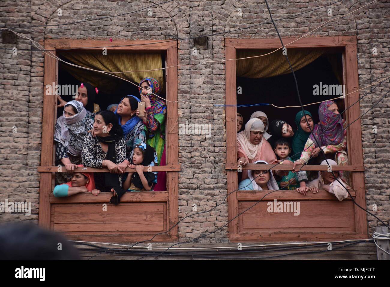 Srinagar, Jammu & Kashmir, India, May 5, 2018.  People watching funeral procession of Local Militant Fayaz Ahmed Hamal at his residence Khankah area of Srinagar Summer Capital Of Indian Kashmir on Saturday.Multiple Funeral processions held in srinagar summer capital of Indian Kashmir on Saturday of Fayaz Ahmed Hamal a LeT (Lashkar-e-Taiba) Militant and a Civilian Adil Ahmed Yatoo who were killed by armoured vehicle on Saturday during clashes near Encounter site.litant at their residence. Credit: ZUMA Press, Inc./Alamy Live News Stock Photo