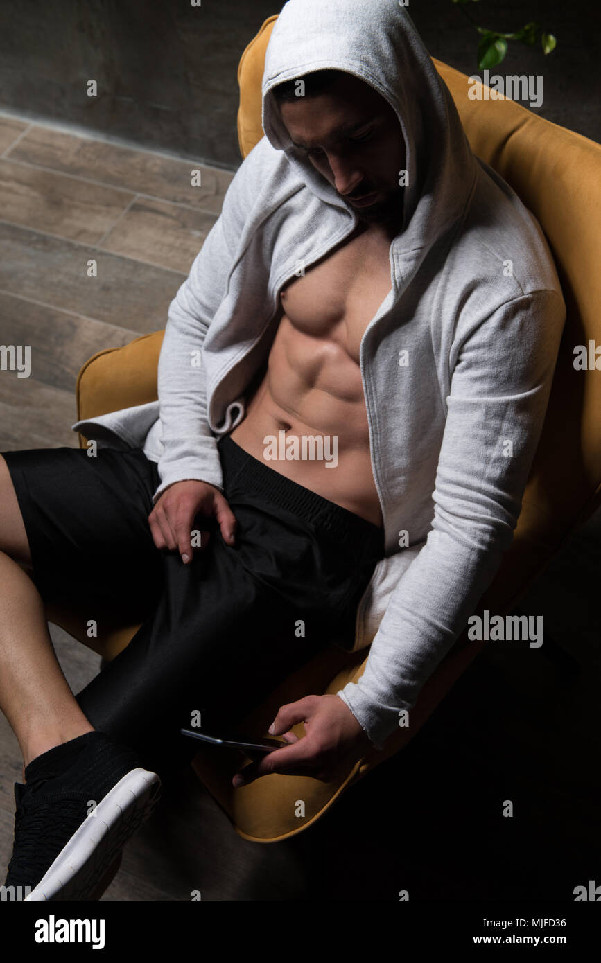 Handsome Good Looking And Attractive Young Man With Muscular Body Relaxing Stock Photo