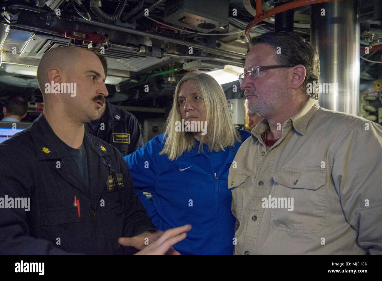 BEAUFORT SEA, Arctic Ocean (March 18, 2018) – Susan Gordon, principal deputy, Director of National Intelligence, Senator Gary Peters talks with a Sailor assigned to the Seawolf-class fast-attack submarine USS Connecticut (SSN 22) as it participates in Ice Exercise (ICEX) 2018, March 18. ICEX 2018 is a five-week exercise that allows the Navy to assess its operational readiness in the Arctic, increase experience in the region, advance understanding of the Arctic environment, and continue to develop relationships with other services, allies and partner organizations. (U.S. Navy Stock Photo
