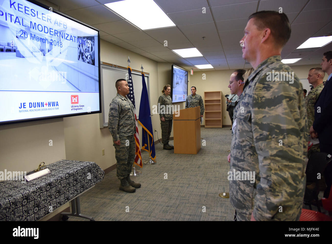 Keesler personnel stand at attention during the singing of the national