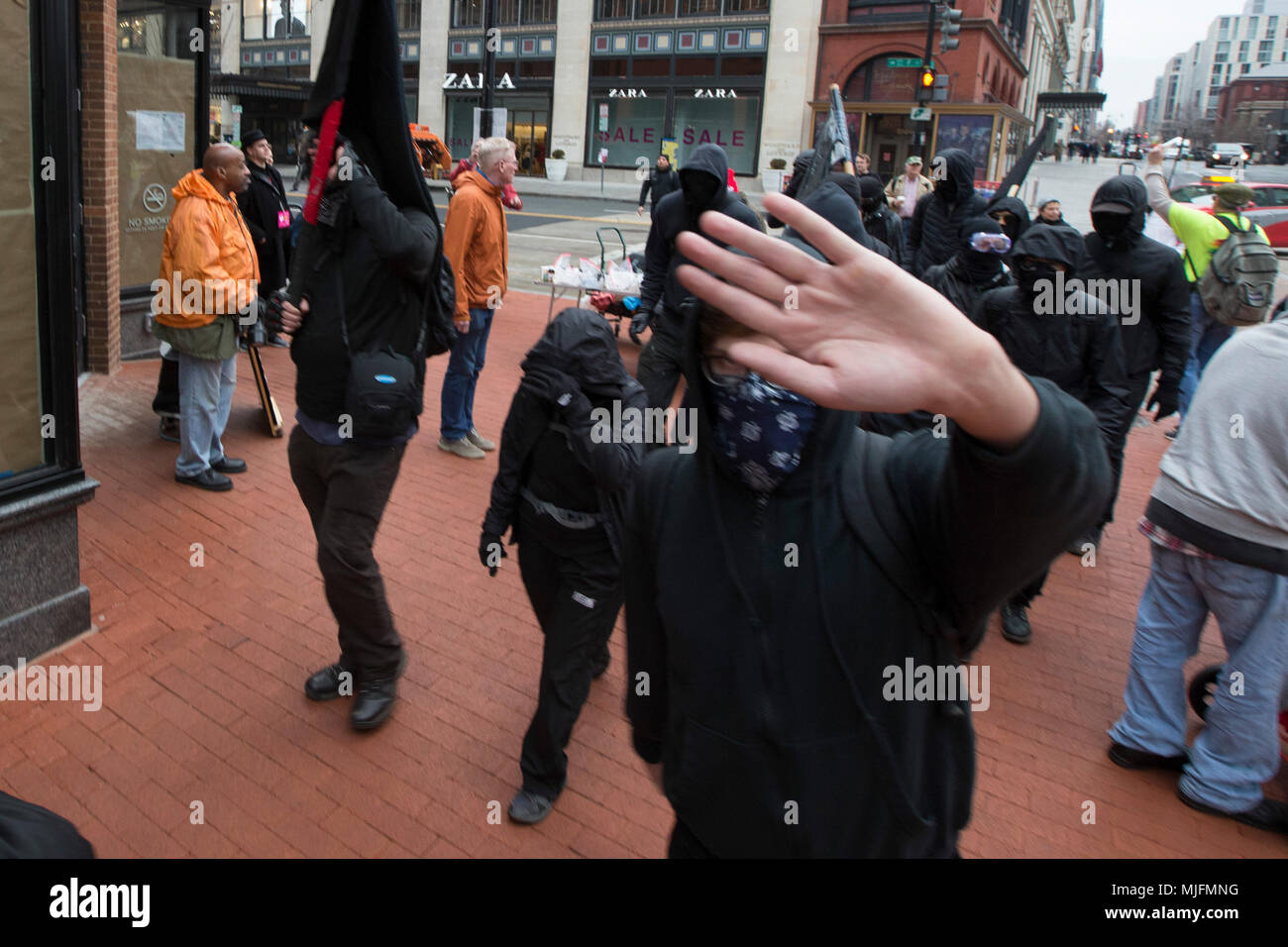 A member of the black bloc, an Antifa organization, marches near a security checkpoint prior to the inauguration of United States President Donald J. Trump in Washington, DC on January 20, 2017. Stock Photo