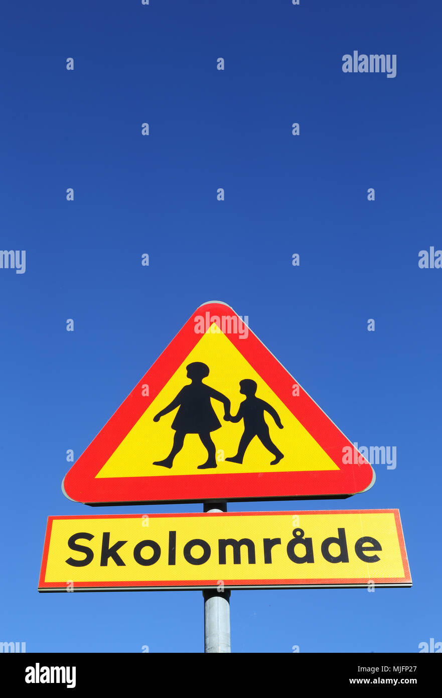 Swedish road sign beware of children with additional panel indicating a school area. Stock Photo