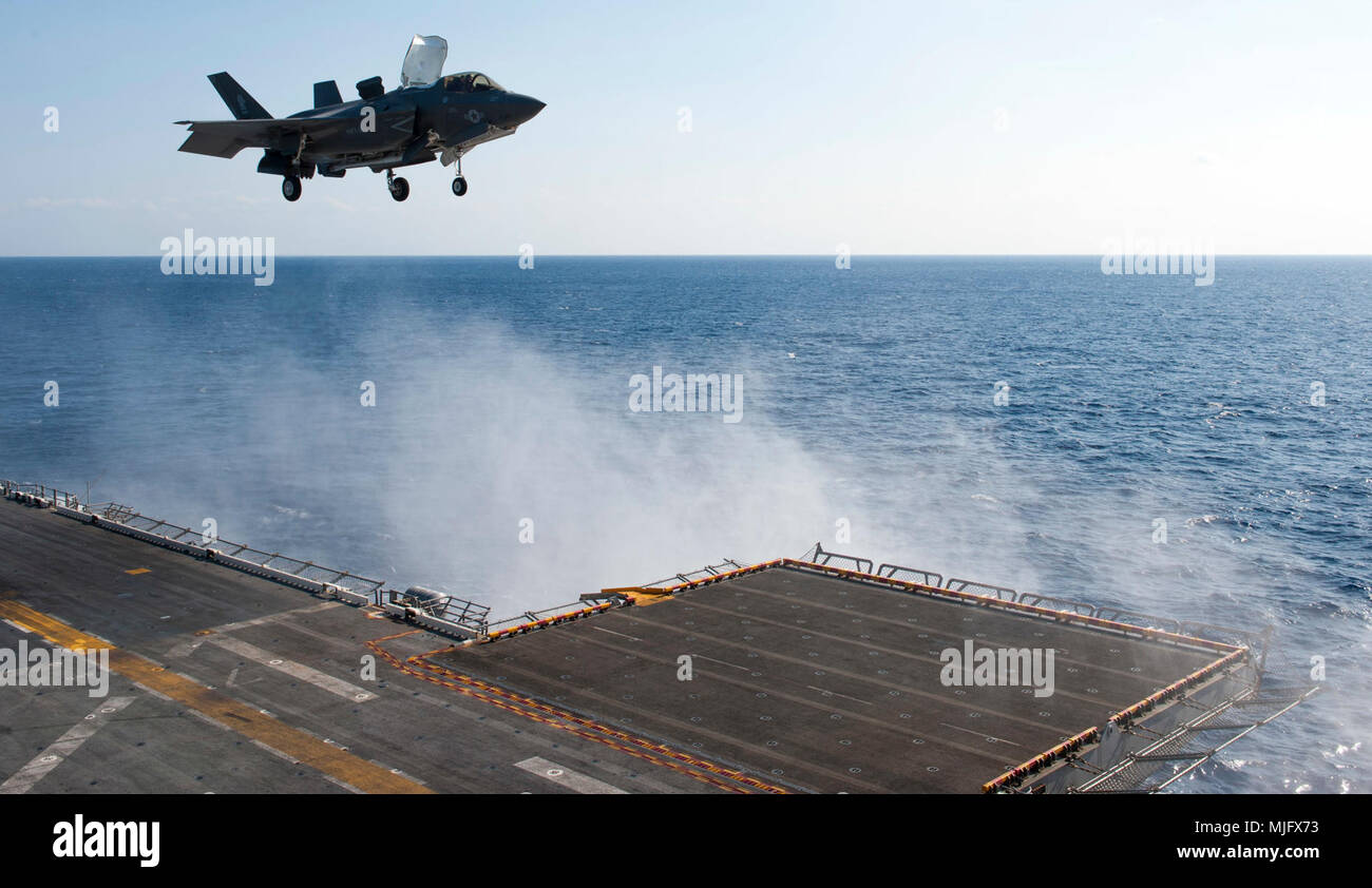 PHILIPPINE SEA (March 23, 2018) An F-35B Lightning II lands on the flight deck of the amphibious assault ship USS Wasp (LHD 1). Wasp, part of the Wasp Expeditionary Strike Group, with embarked 31st Marine Expeditionary Unit, is operating in the Indo-Pacific region to enhance interoperability with partners, serve as a ready-response force for any type of contingency and advance the Up-Gunned ESG Concept. (U.S. Navy Stock Photo