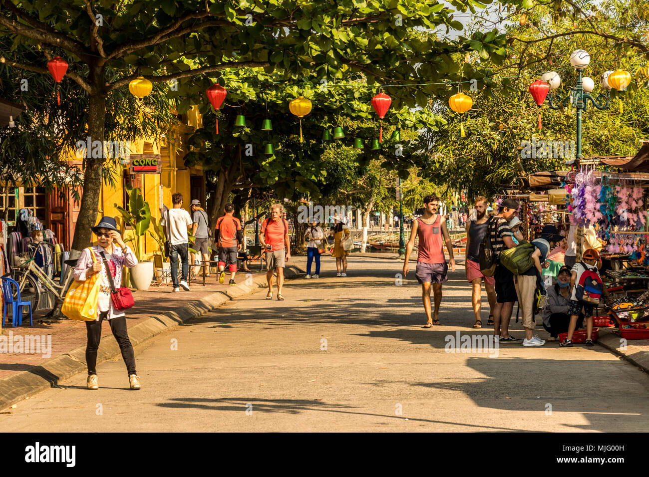 Tourist shopping and exploring Vietnamese town of Hoi An Vietnam Stock Photo Alamy