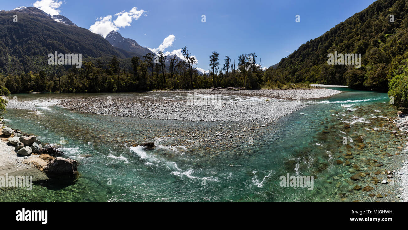 Panoramic view of a beautiful turquoise river at the end of the Hollyford Road, near Milford Sound, Fiordland National Park, New Zealand Stock Photo