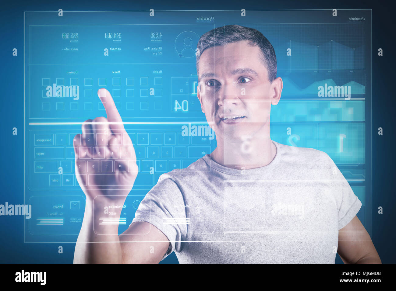 Emotional programmer looking impressed while working with his new equipment Stock Photo