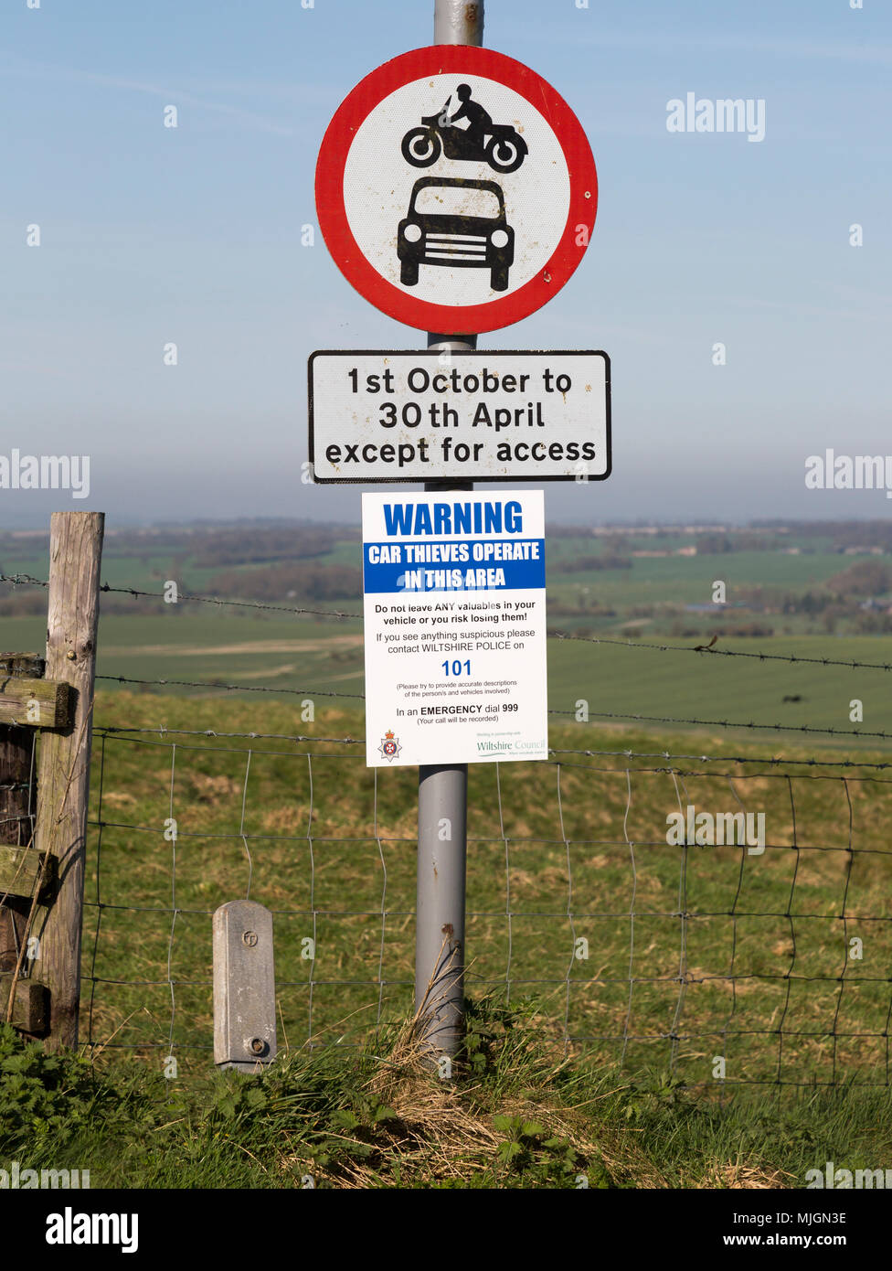 Road signs and car thieves warning sign,  Ridgeway at Hackpen Hill, Wiltshire, England, UK Stock Photo