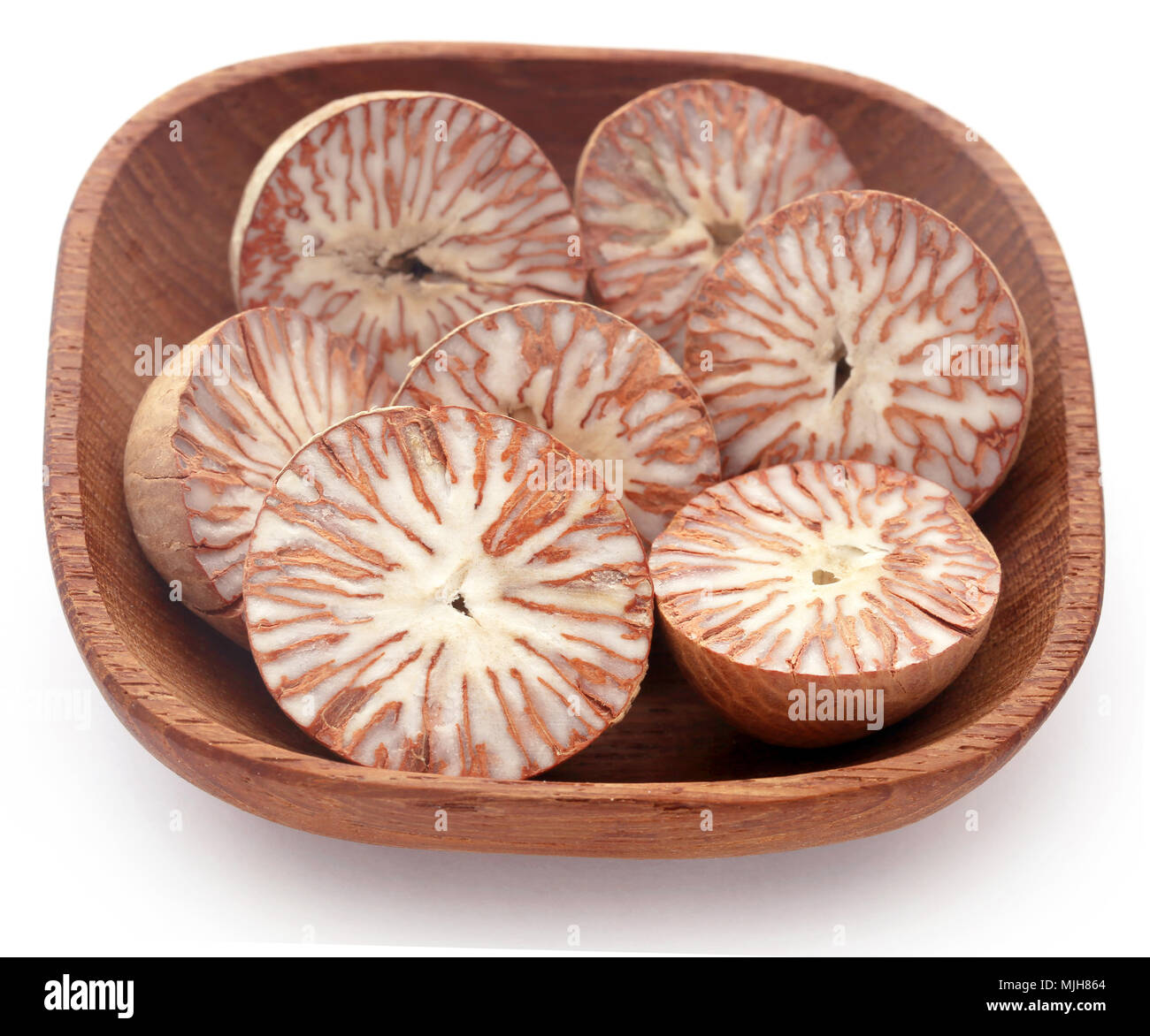 Betel nuts in a bowl over white background Stock Photo