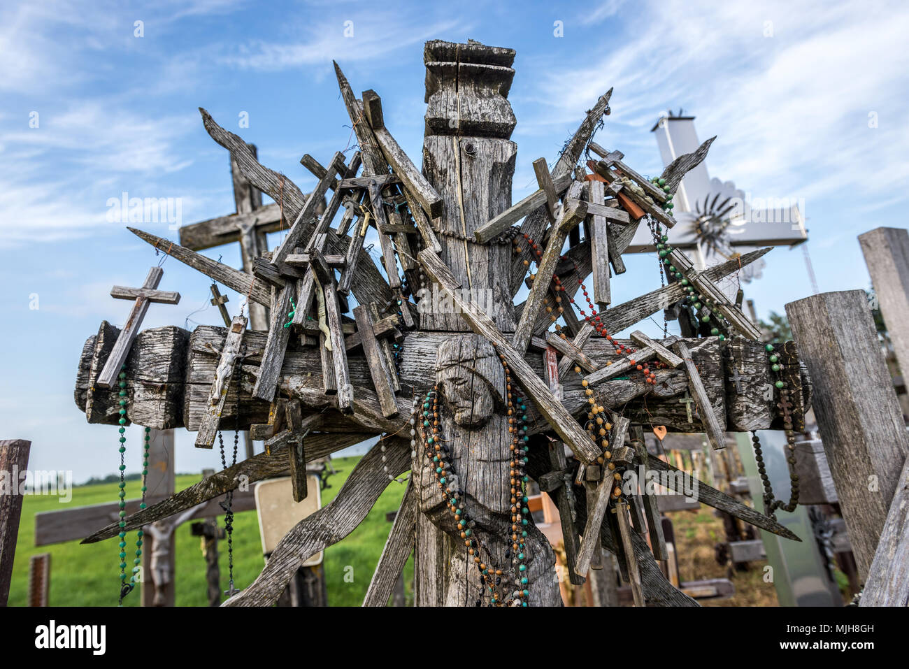 Small wooden crosses on a large one on Hill of Crosses in Lithuania Stock Photo